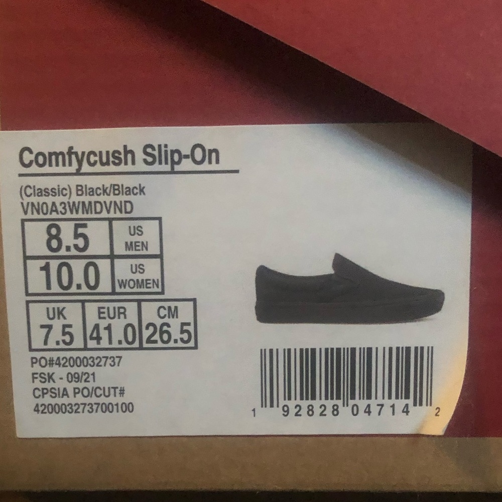 Black/black vans slip on